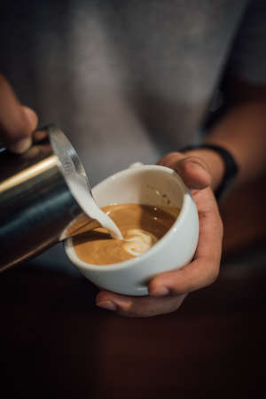 coffee latte art in coffee shop in vintage color toneの写真素材