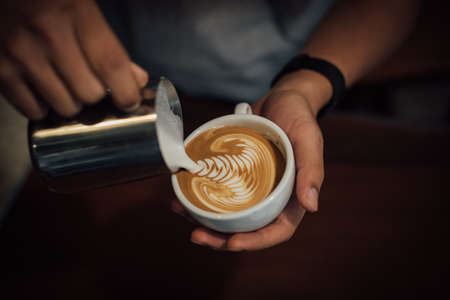 coffee latte art in coffee shop in vintage color toneの写真素材