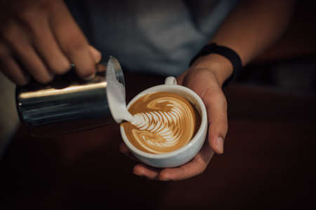 coffee latte art in coffee shop in vintage color toneの写真素材