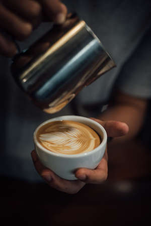coffee latte art in coffee shop in vintage color toneの写真素材