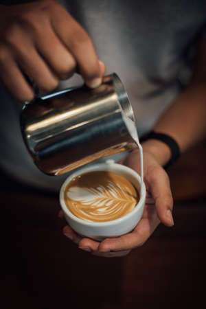 coffee latte art in coffee shop in vintage color toneの写真素材