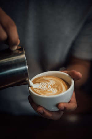 coffee latte art in coffee shop in vintage color toneの写真素材