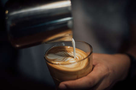 coffee latte art in coffee shop in vintage color toneの写真素材