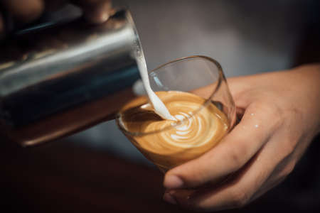 coffee latte art in coffee shop in vintage color toneの写真素材