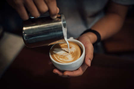 coffee latte art in coffee shop in vintage color toneの写真素材