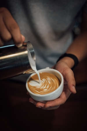 coffee latte art in coffee shop in vintage color toneの写真素材