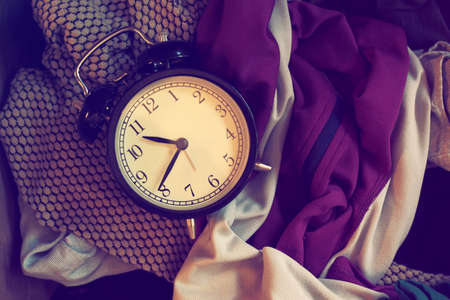vintage alarm clock in vintage coloの写真素材