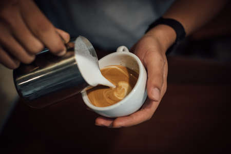 coffee latte art in coffee shop in vintage color toneの写真素材
