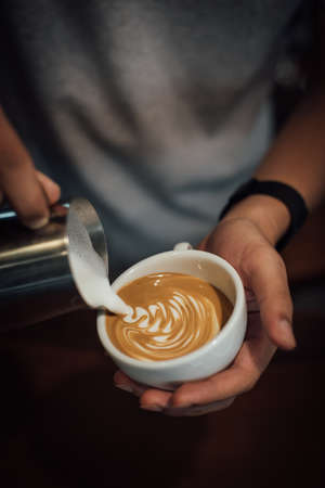 coffee latte art in coffee shop in vintage color toneの写真素材