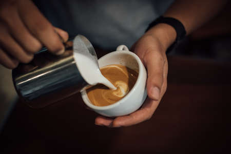 coffee latte art in coffee shop in vintage color toneの写真素材