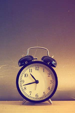 vintage alarm clock in vintage coloの写真素材