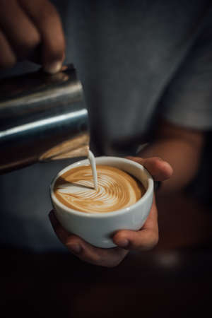 coffee latte art in coffee shop in vintage color toneの写真素材