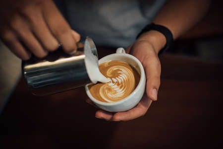 coffee latte art in coffee shop in vintage color toneの写真素材
