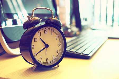 vintage alarm clock in vintage coloの写真素材