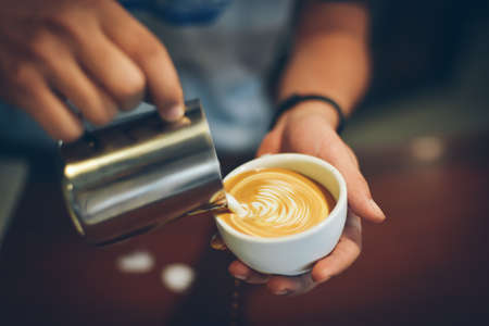 coffee latte art in coffee shop vintage color toneの写真素材