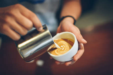 coffee latte art in coffee shop vintage color toneの写真素材