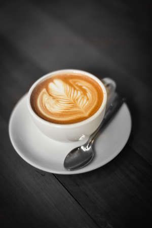 coffee latte : coffee latte art make by coffee maker barista in coffee shop cafe with  vintage color toneの写真素材
