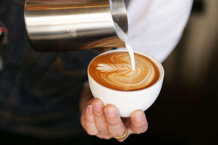 close up barista hand making a cup of coffee.の写真素材