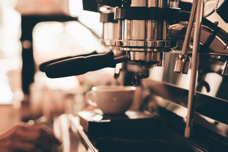 close up barista hand making a cup of coffee.の写真素材