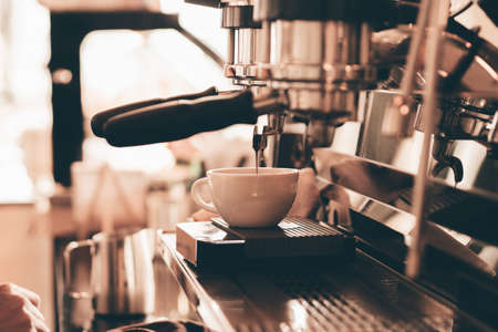 close up barista hand making a cup of coffee.の写真素材
