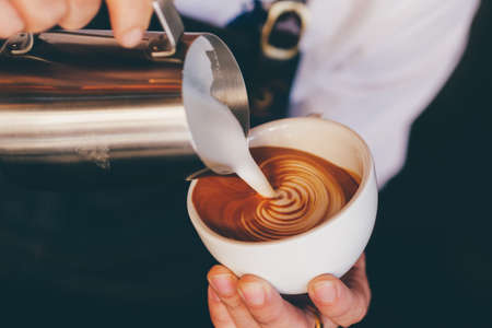 close up barista hand making a cup of coffee.の写真素材