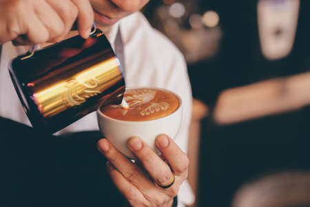 close up barista hand making a cup of coffee.の写真素材