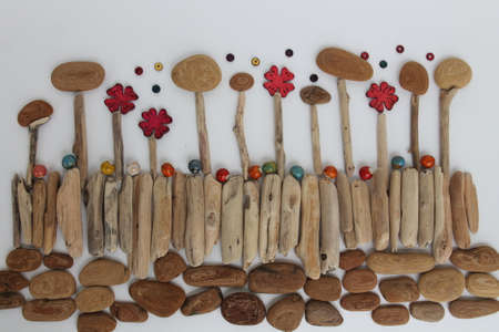 Nature, environment and botany - tree bark, branches and flowers with ceramic beads.の写真素材