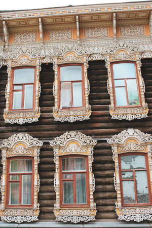 Vintage wooden window with lace curtain, Tomsk Russiaの写真素材