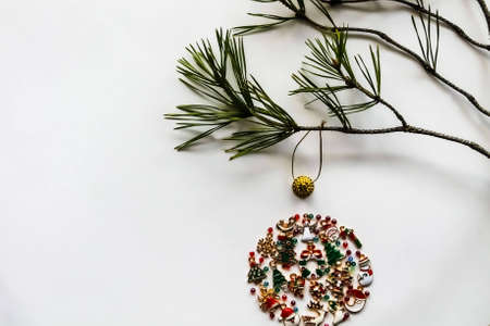 Christmas tree decorations formed from a small ornament of baubles on a white backgroundの写真素材