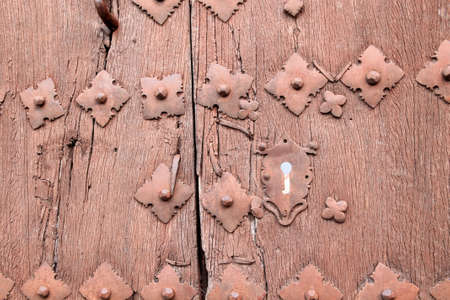 Old wooden door with keyhole. Andalusia Spain.の写真素材