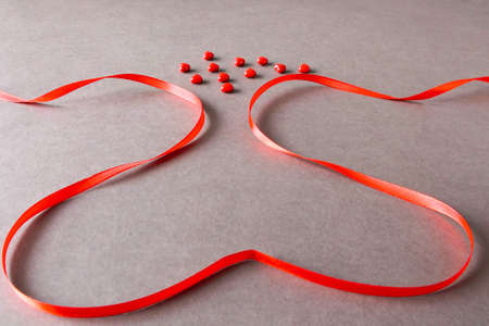 Valentine's Day heart-shaped red ribbon backgroundの写真素材