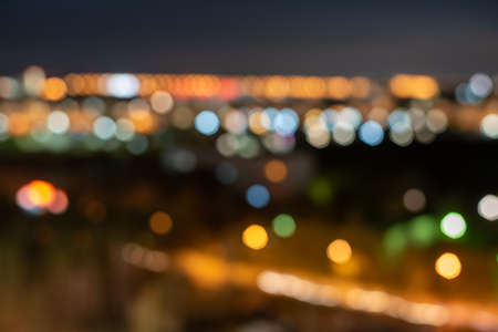 Abstract urban night light bokeh defocused backgroundの写真素材