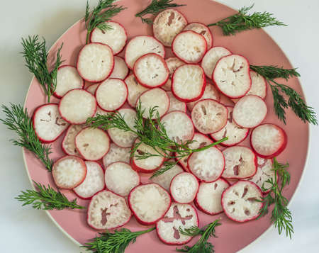 Top view on chopped radish on a plate.の写真素材