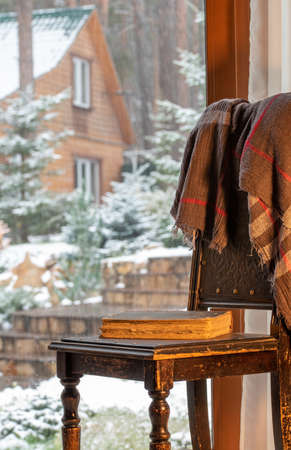 Home comfort in winter - retro things in front of a window to the gardenの写真素材