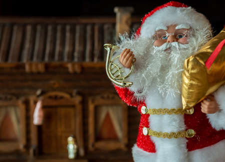 Toy Santa Claus with a bag of Christmas giftsの写真素材