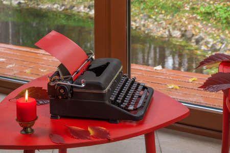Red Viennese chairs and a typewriter.の写真素材