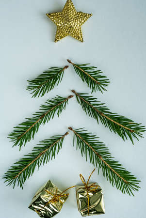 Christmas tree with gifts on the table flat layの写真素材