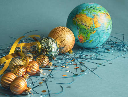 New Years decoration - blue, gold balls and a globeの写真素材