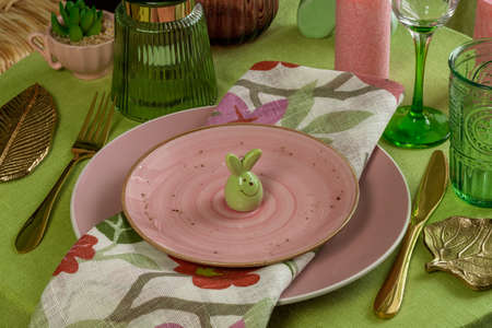 Spring table setting for Easter in pink and green.の写真素材