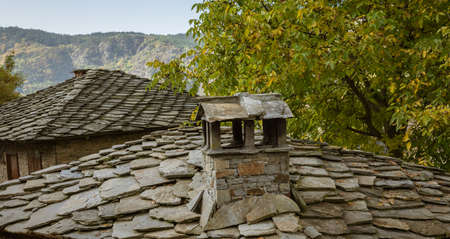 Old traditional Bulgarian house in mountain village of Kovachevitsa. Traditional slan stone roofsの写真素材