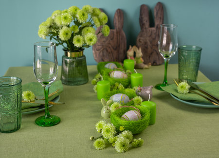 Set table with Easter decoration - eggs in nests and flowersの写真素材