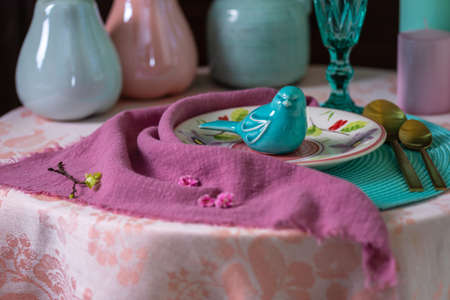 Table setting in pink and turquoise colors, spring dayの写真素材