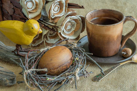 Easter composition made of natural materials with beige-brown color.