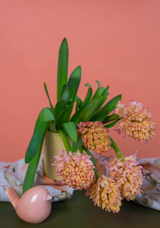 Bouquet of yellow-orange hyacinths with spring decorationsの写真素材