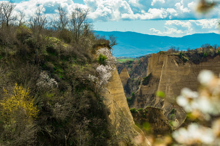 Flowering of dogwood and apple tree in early spring in sandy rocks near Melnik Bulgariaの写真素材