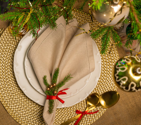 New Years table setting in gold color with a linen napkinの写真素材