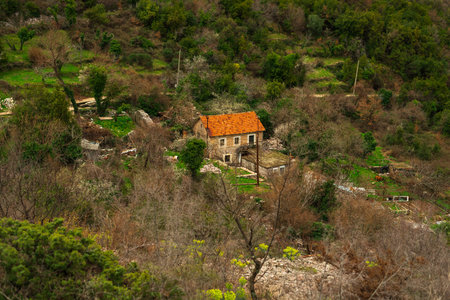 Mountain village with tiled roofs in the Bay of Kotor. Trekking in spring.の写真素材