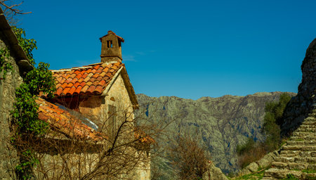 Old house with a tiled roof in the mountain village of Gorny Stoliv, Montenegro.の写真素材