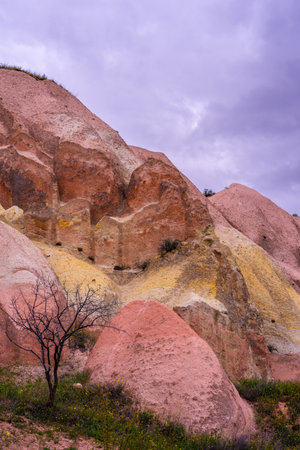 Martian landscape in Cappadocia, unique relief of mountains painted in yellow and pink colorsの写真素材