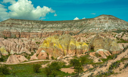 Panoramic view of Goreme national park with over deep canyons, valleys sunset Cappadocia. Popular Turkey touristic destination for summer holidays.の写真素材